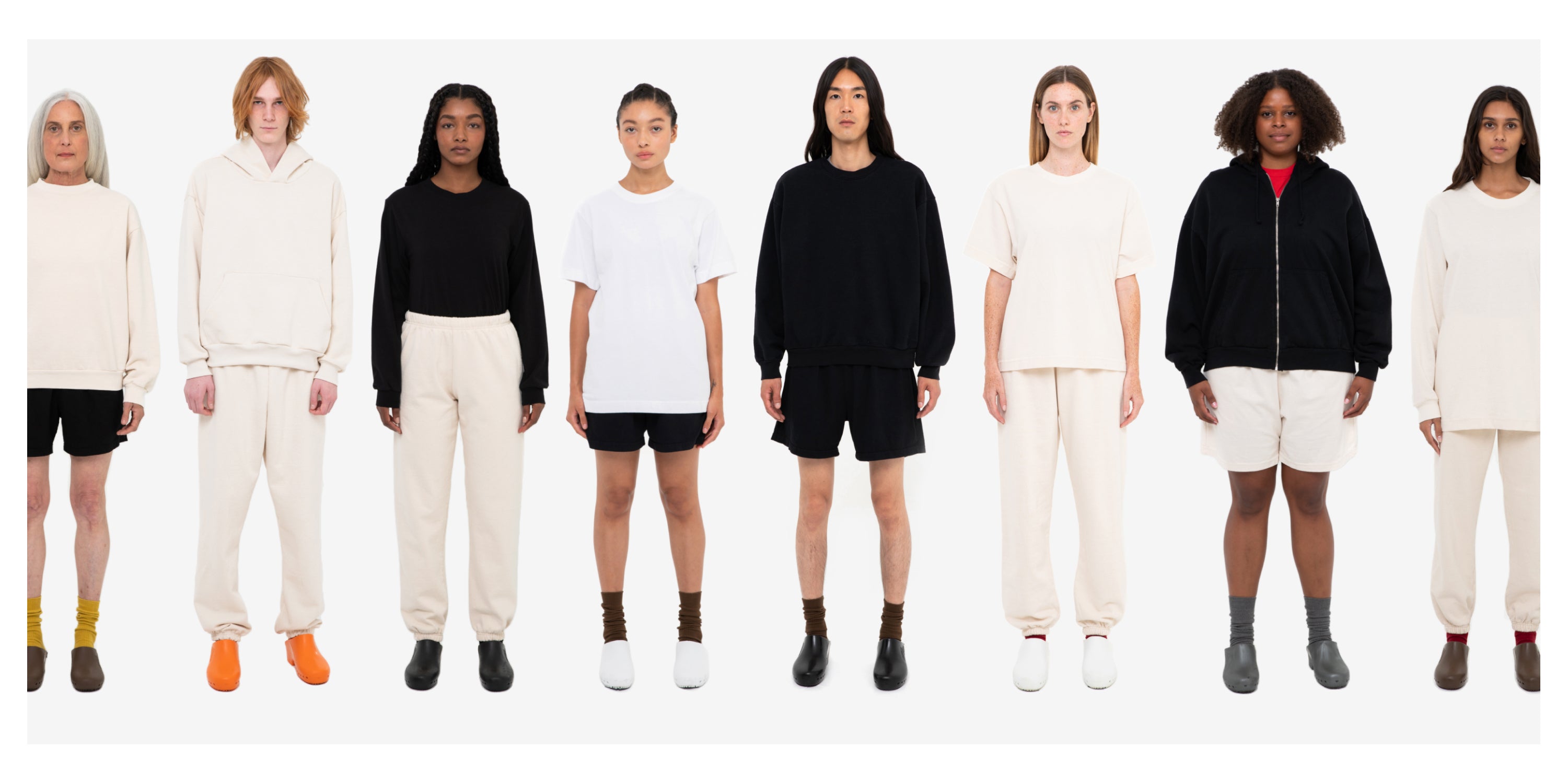 8 models against white background, looking straight ahead and wearing variations of White, Scour, and Black E.W styles.