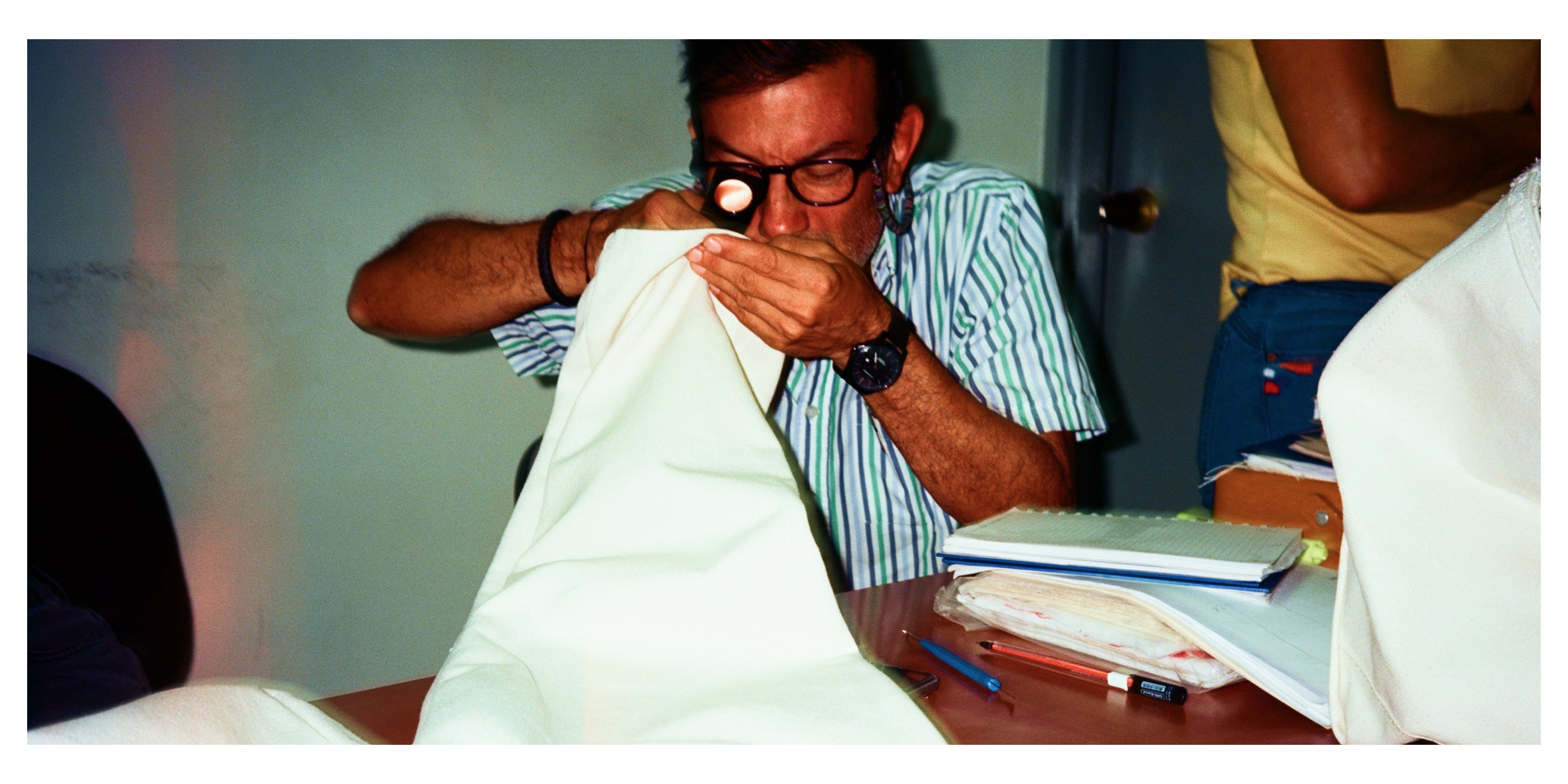 Our worker checking the quality of the stitching pattern in our rolls of fabric