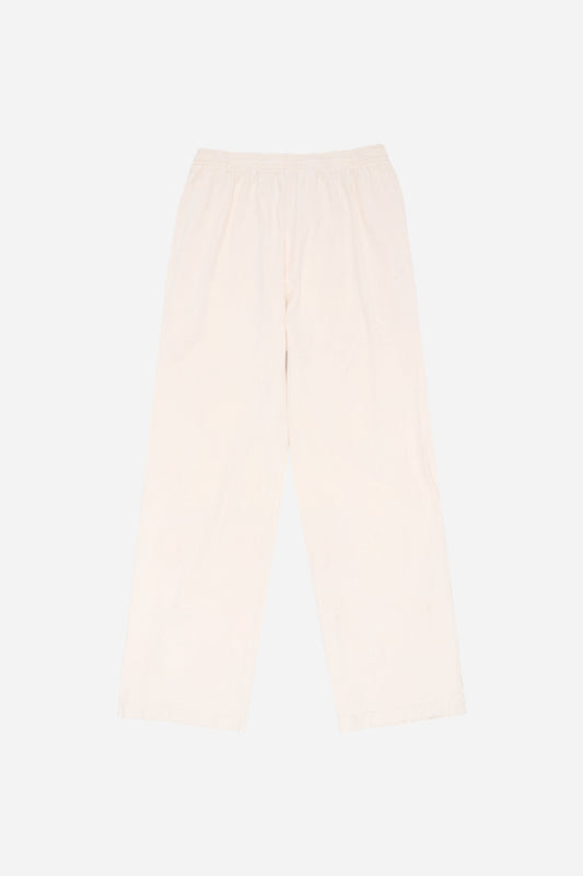 Flat lay of Apartment Pants in Scour light beige, showing the full length and straight leg of the relaxed-fit design.