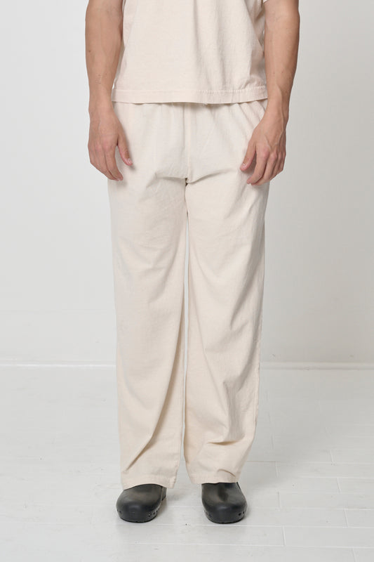 Front view of a person in Scour Apartment Pants, showing the elastic waistband and relaxed drape