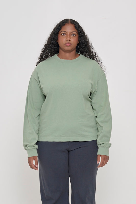 A 5'8" woman in a size M. Shirt hem hits the mid hip.