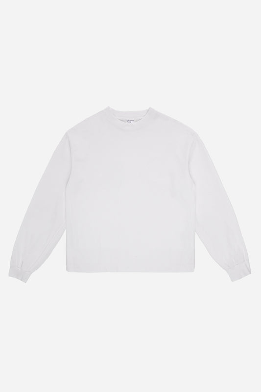 Flat lay of White Long Sleeve Boxier Trash Tee showing the cropped boxy silhouette.