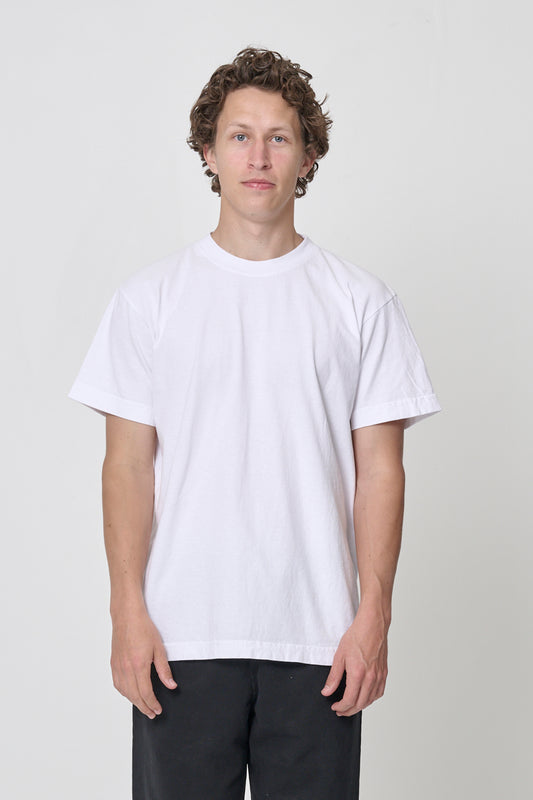 6' man in a size L White Short Sleeve Trash Tee and shirt hem ends just below his hips