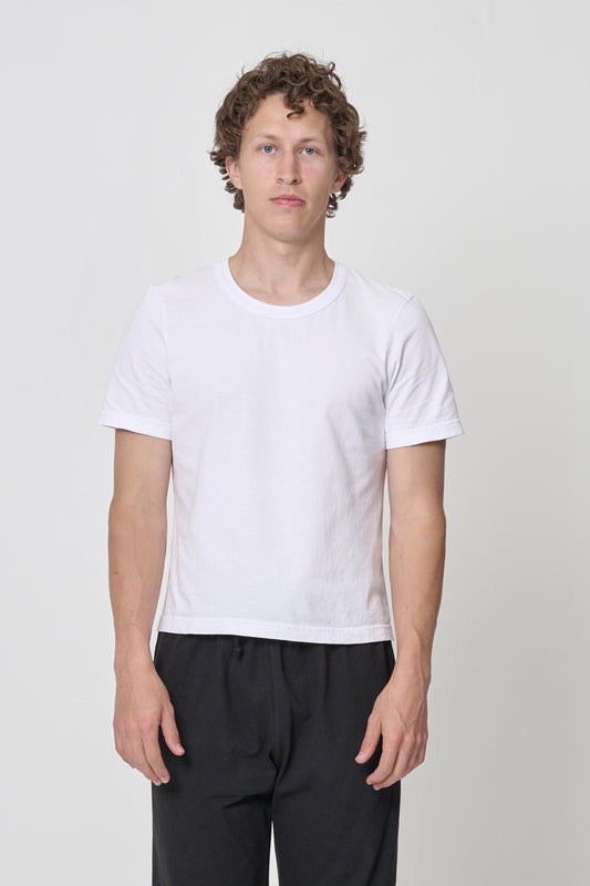 6' man wearing White Tailored Trash Tee in Size L, shirt hem hits his upper middle hip.