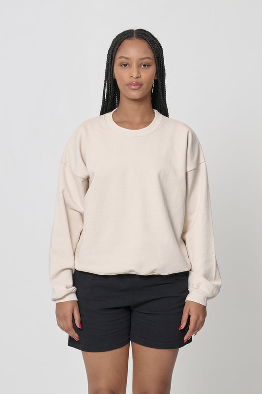 Front view: 5'10" woman wearing Scour Trash Crewneck in size M. Hem hits her upper hip.