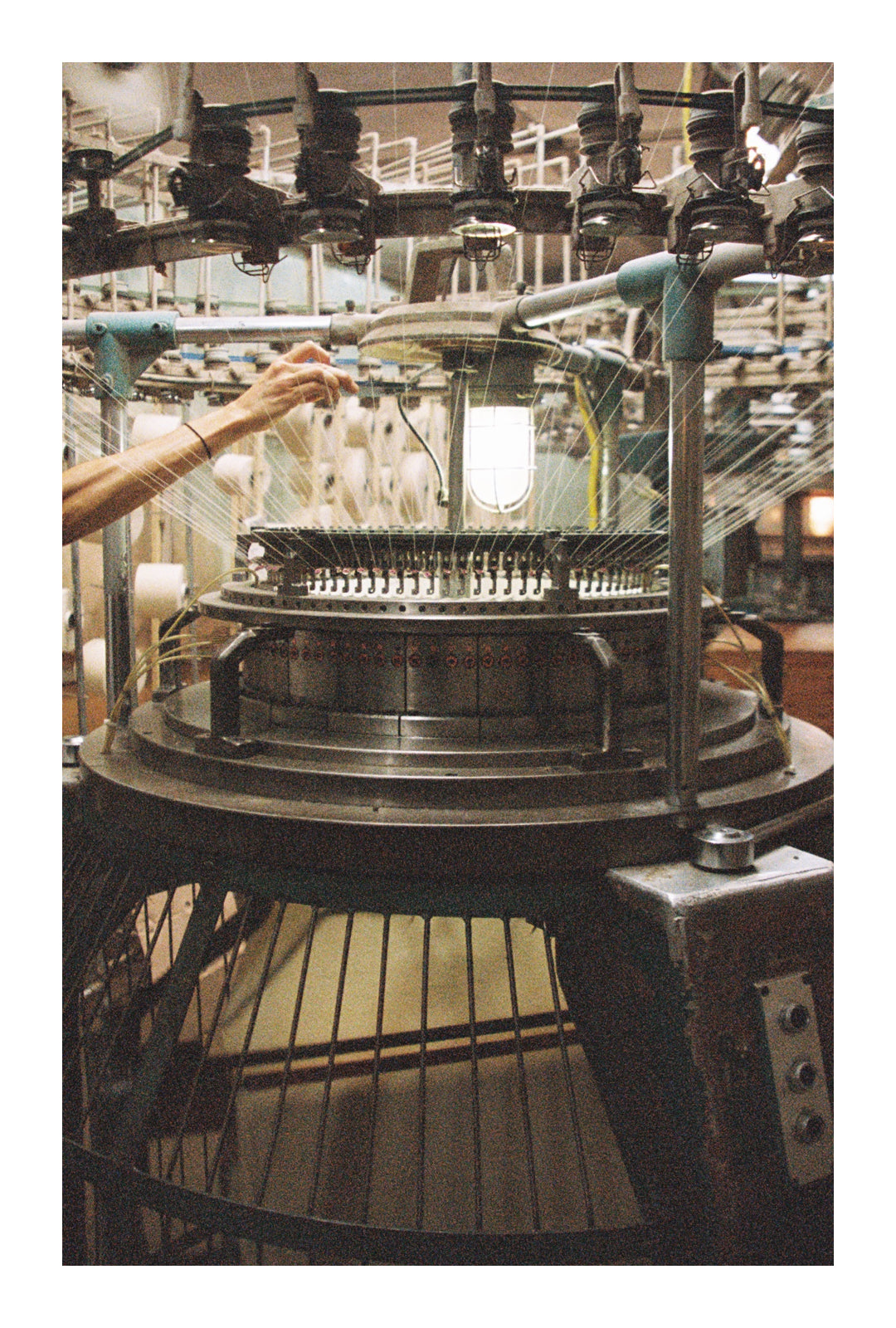 worker sewing together our raw cotton