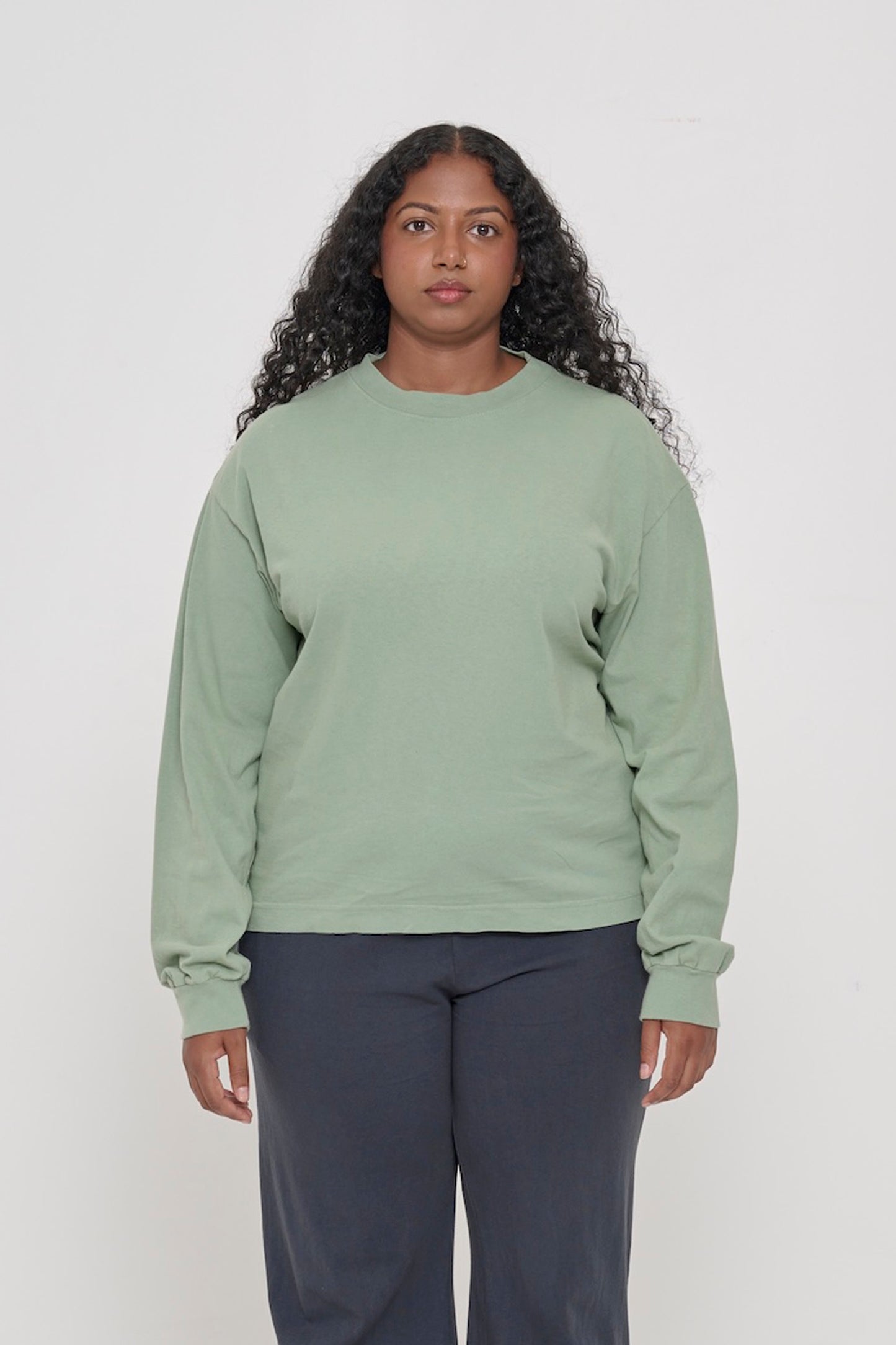 A 5'8" woman in a size M. Shirt hem hits the mid hip.