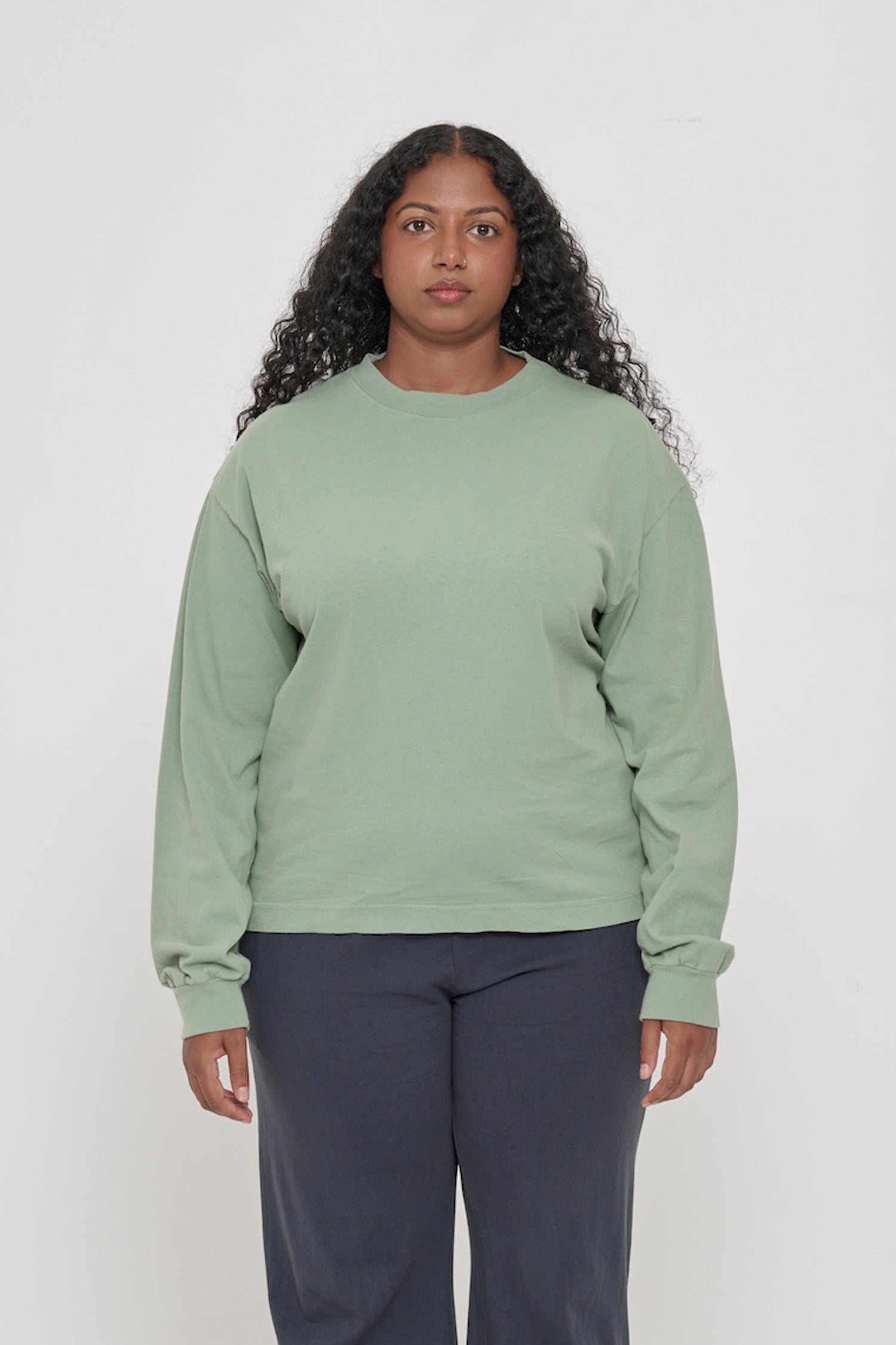 A 5'8" woman in a size M. Shirt hem hits the mid hip.