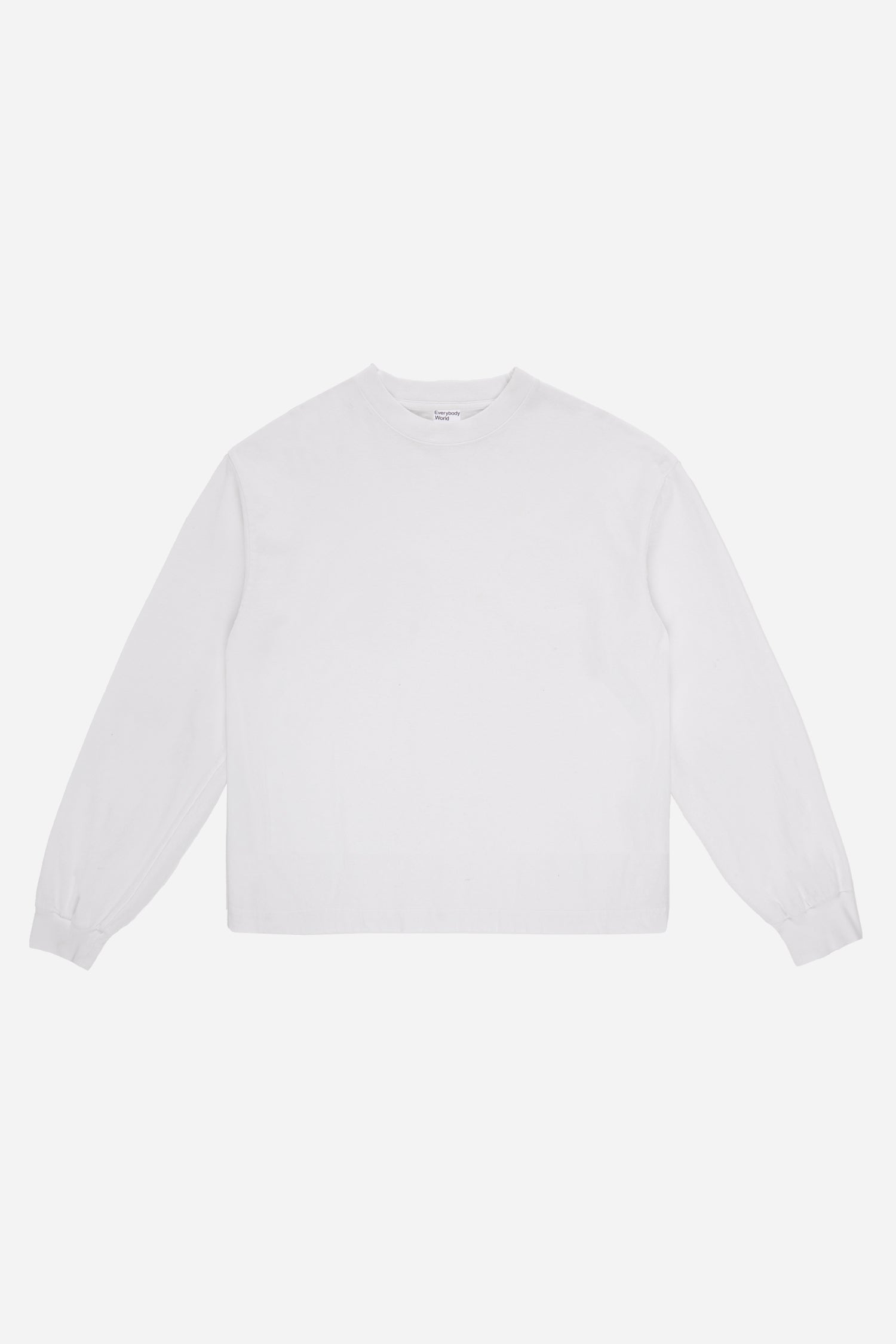 Flat lay of White Long Sleeve Boxier Trash Tee showing the cropped boxy silhouette.