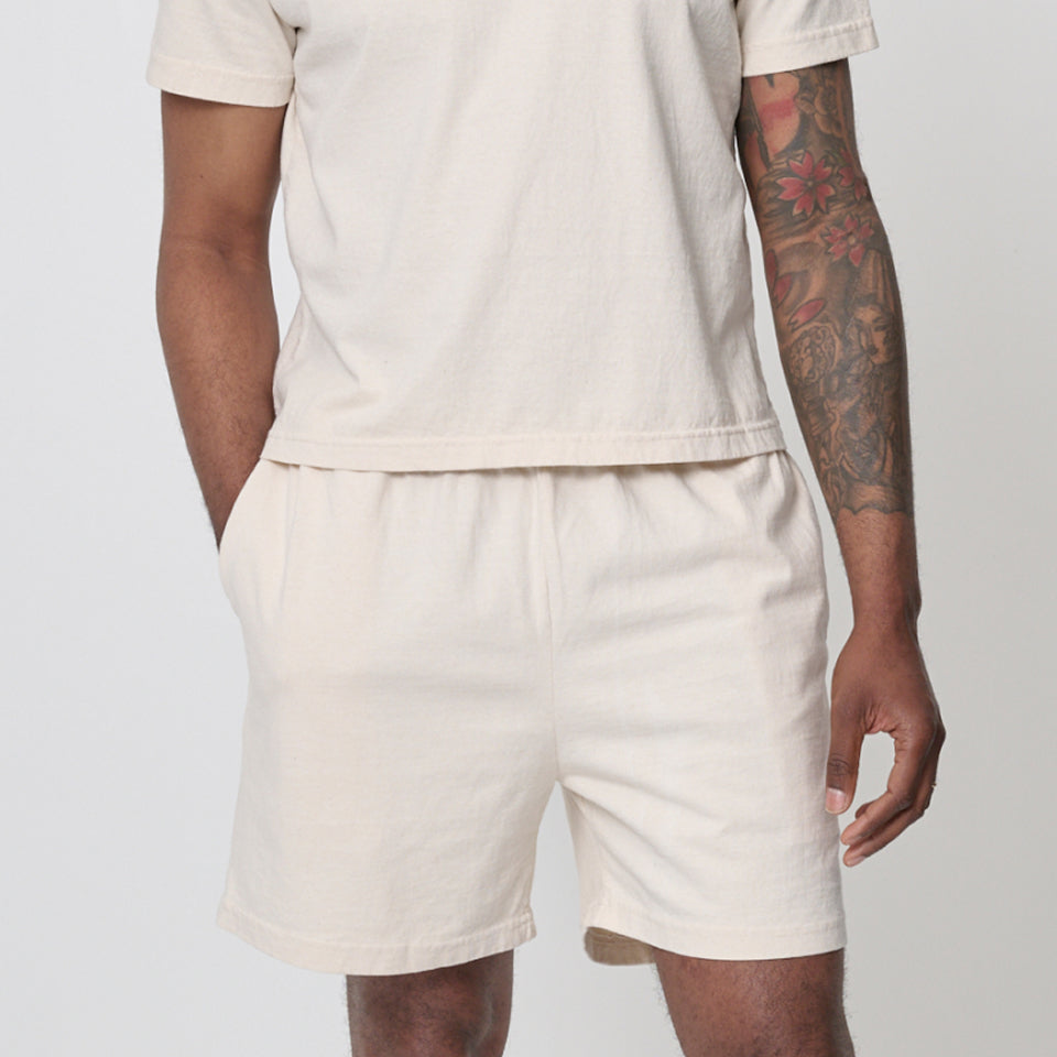 Person wearing a Trash Tee and Everyday Shorts both in Scour.