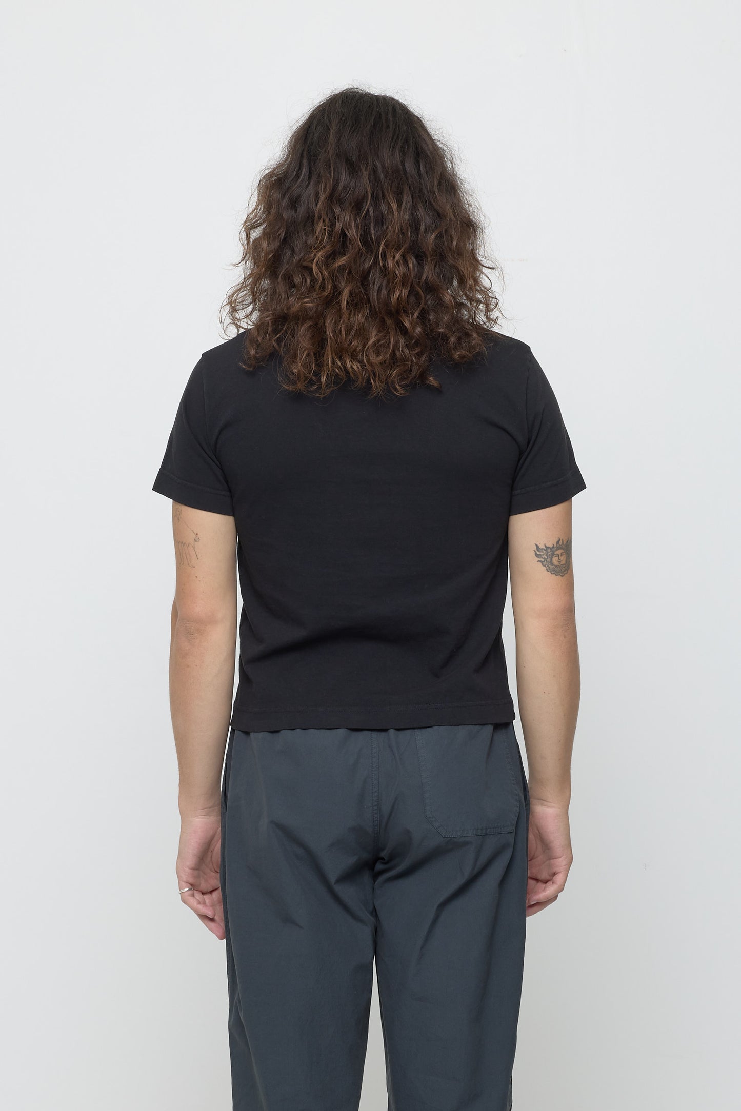 Back view: fitted across upper back and relaxed at middle and lower back