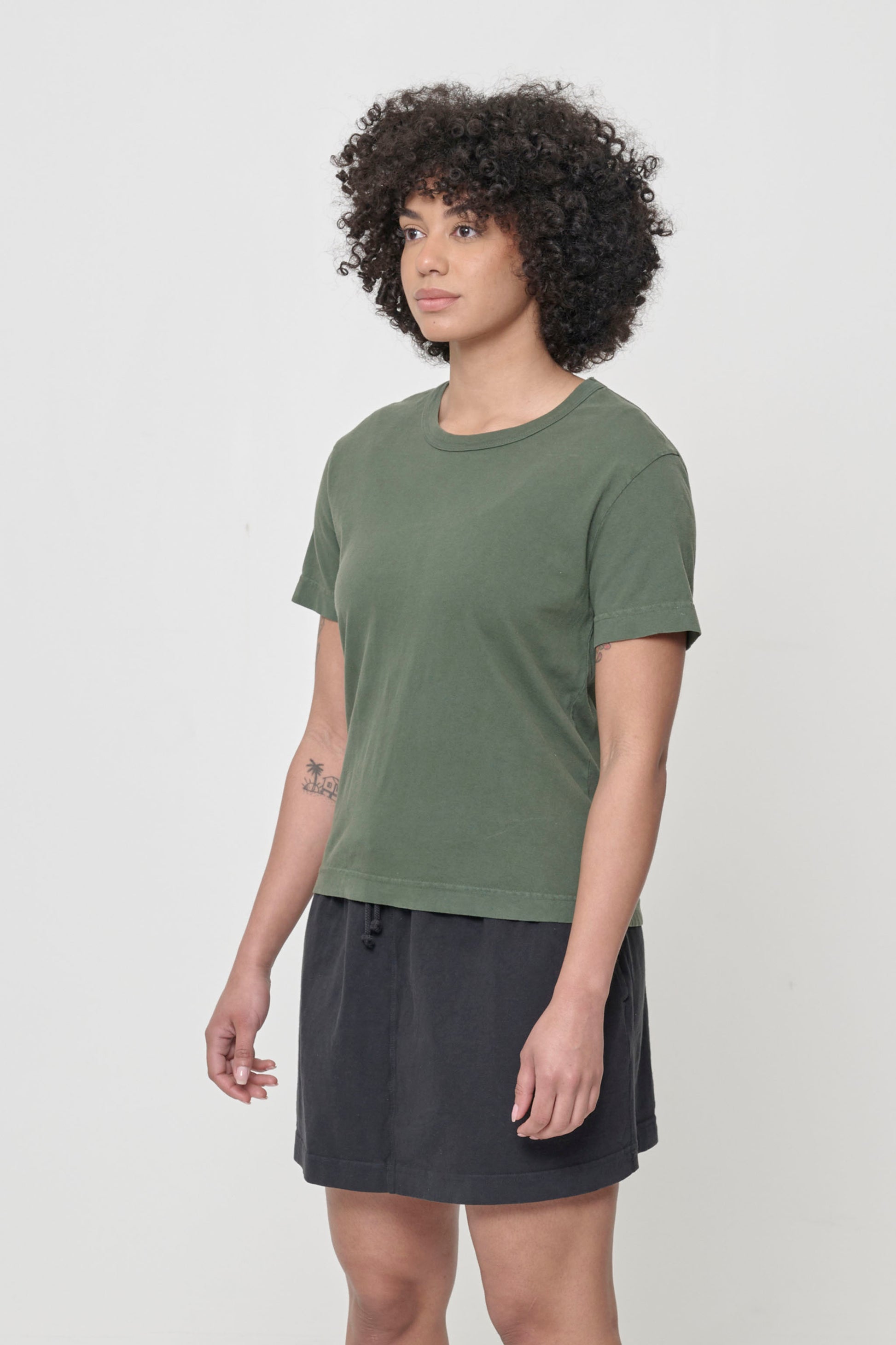 3/4 front view showing side seams and slim short sleeves.